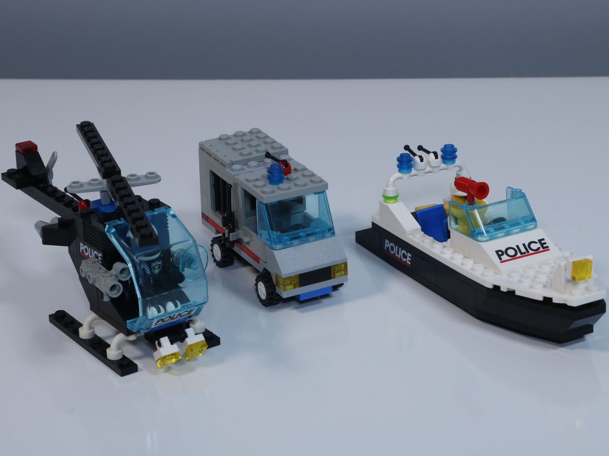 The police helicopter, police car, and police boat from the LEGO Police Station (set 6598). 