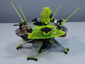 LEGO Cyber Saucer (set 6900) with its top open, revealing a minifigure seated inside the cockpit. 