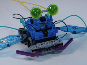 A close-up front view of the LEGO Mindstorms Discovery Set (set 9735) insect model, focusing on its large, bug-like eyes. 