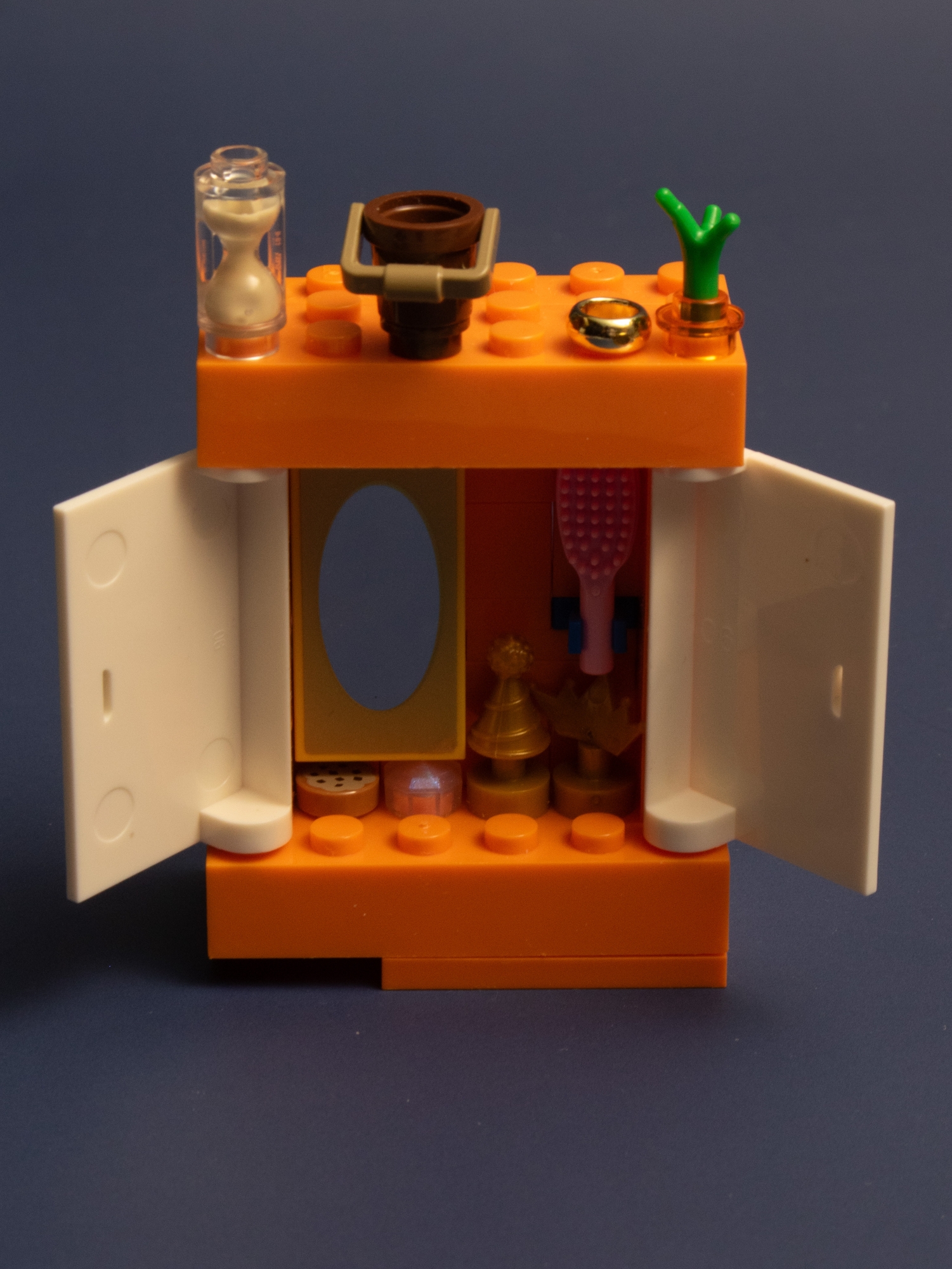 An open wardrobe designed for a LEGO mermaid-themed Polly Pocket house. 