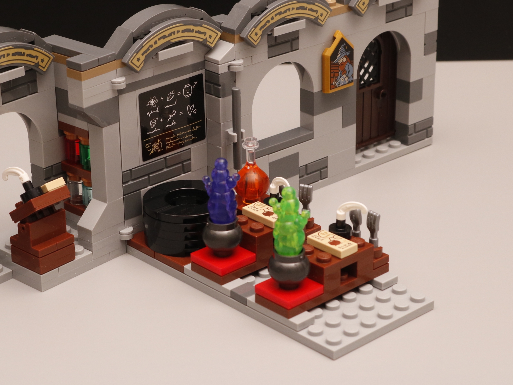 Closeup of potions on desks in LEGO set 76431 Hogwarts Castle: Potions Class.